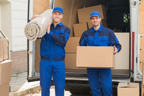 People organizing items in Stamfordhill storage for a tidy and flexible space solution