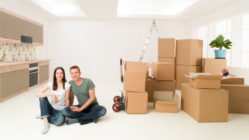 Packed moving boxes and wrapped items ready for transport