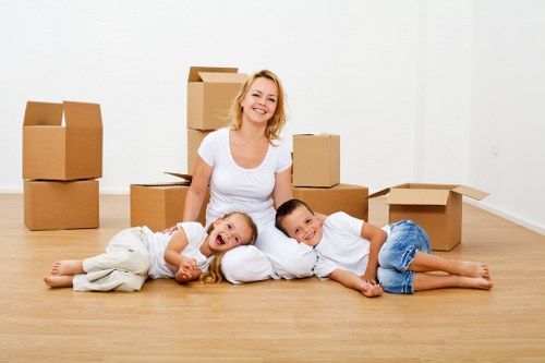 Removal specialists organizing belongings during a Stamfordhill home move